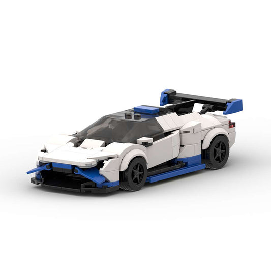 White and blue LEGO sports car model with black wheels and rear spoiler on white background