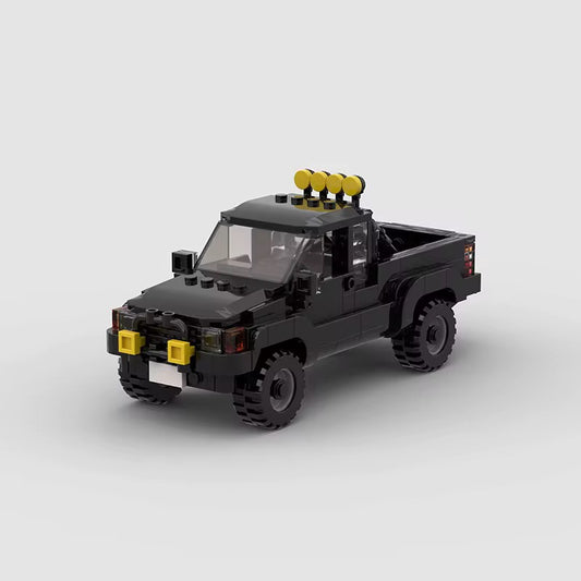 RevvBlox Toyota SR5 truck toy model with detailed blue and black plastic construction and realistic features.
