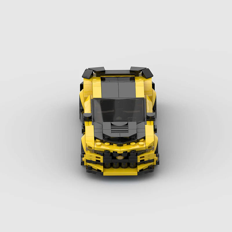 RevvBlox Chevrolet Camaro Bumblebee Transformers toy car in yellow with black details, featuring detailed design and branding.