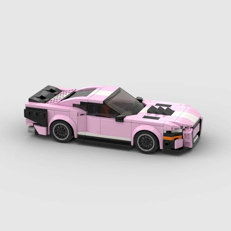 Pink Ford Mustang Shelby GT500 diecast car by RevvBlox, detailed model with sleek pink finish and racing-inspired design.