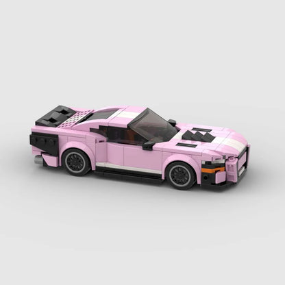 Pink Ford Mustang Shelby GT500 diecast car by RevvBlox, detailed model with sleek pink finish and racing-inspired design.