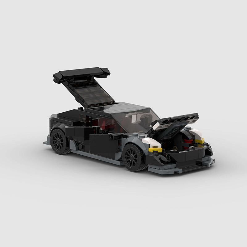 RevvBlox Tesla Model 3 Bionic LEGO-style building block set showing assembled car model with detailed exterior features.