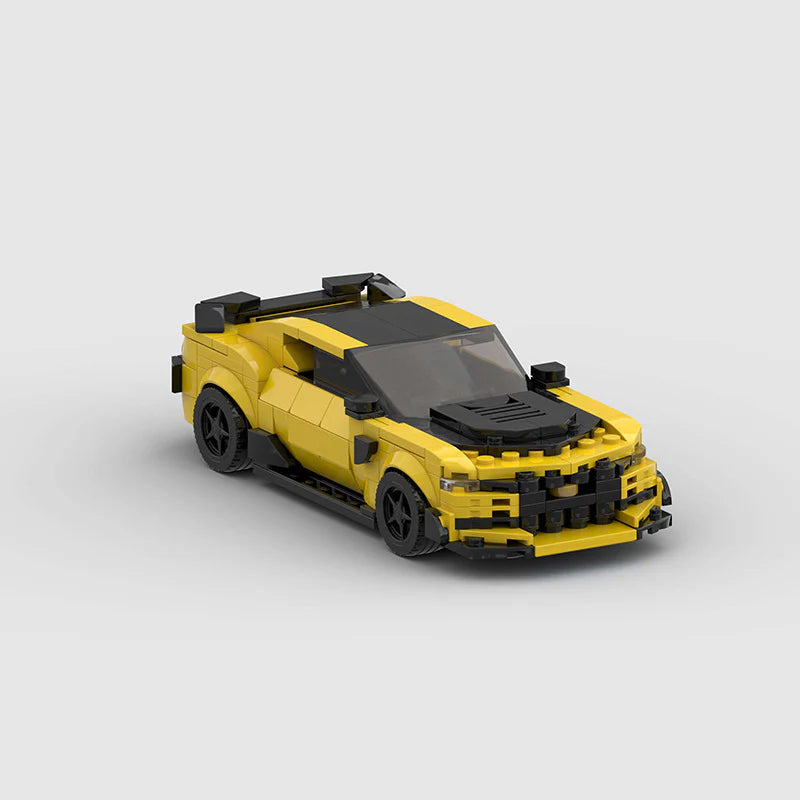 RevvBlox Chevrolet Camaro Bumblebee Transformers toy model, detailed yellow and black car replica with robot features visible.