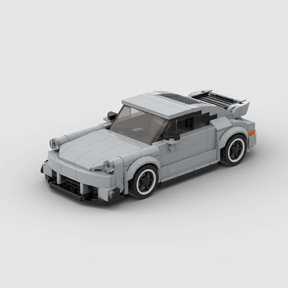 Porsche 911 RWB model by RevvBlox, featuring detailed bodywork and vibrant paint in a dynamic display.