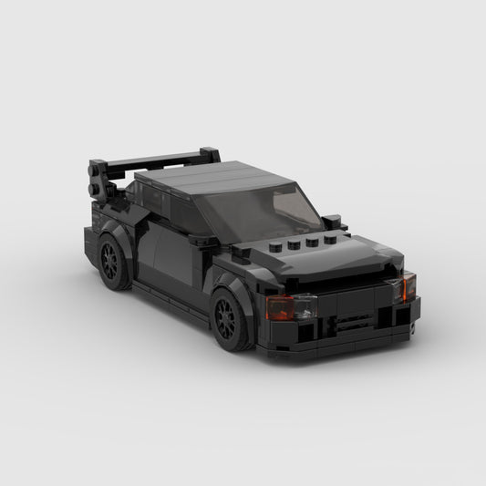 RevVBlox Mitsubishi GTO model car in black with detailed exterior and realistic features, showcasing a high-quality miniature replica.