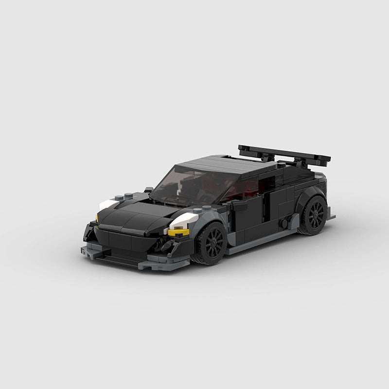 RevvBlox Tesla Model 3 Bionic toy car on a white background, showcasing detailed design and vibrant colors.