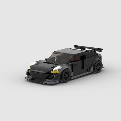 RevvBlox Tesla Model 3 Bionic toy car on a white background, showcasing detailed design and vibrant colors.
