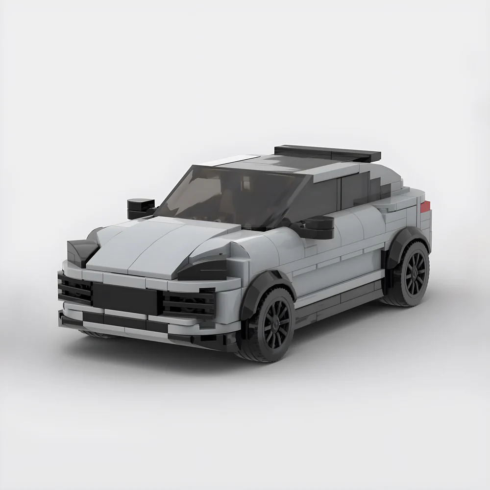 Gray toy car model made from building blocks with black wheels and tinted windows