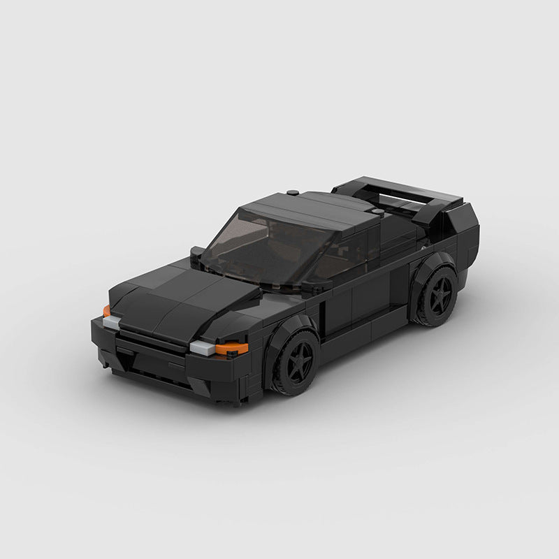 Revvblox Nissan Skyline GT-R R32 "Takeshi" Initial D diecast model car on display.