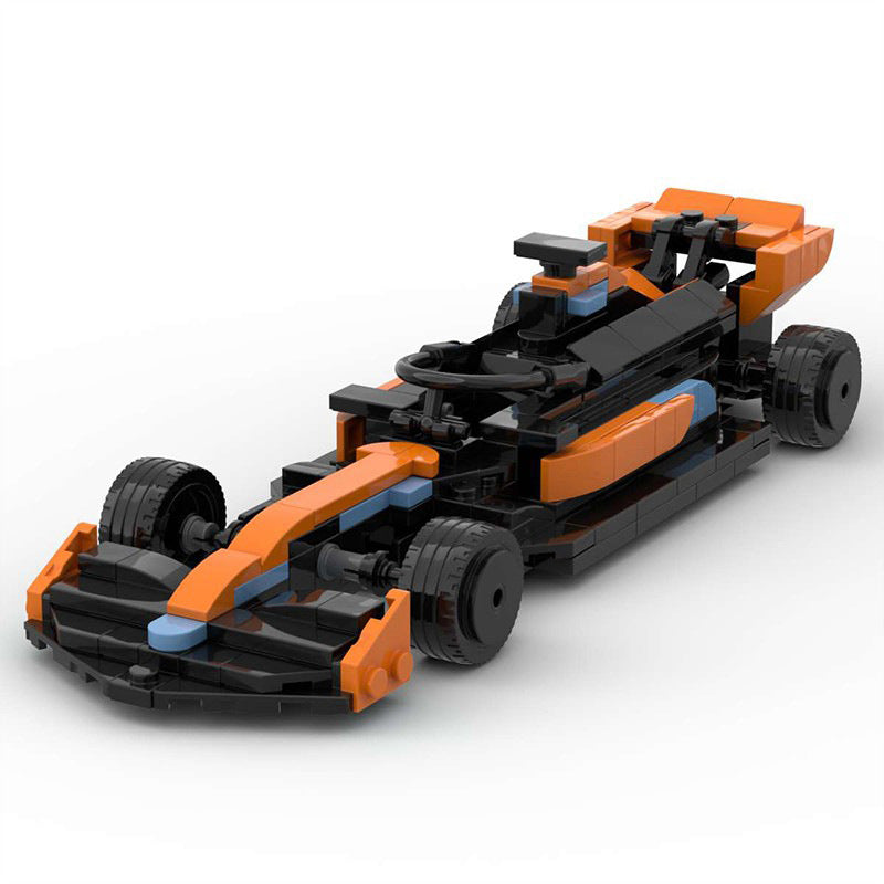 Black and orange LEGO race car model with front wing, steering wheel, and detailed tires