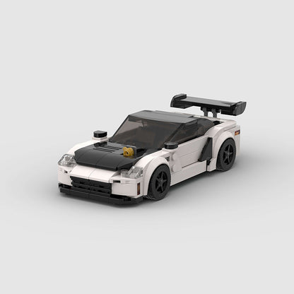 RevVBlox Mitsubishi GTO 3000GT scale model car with detailed red and black exterior and intricate design features.