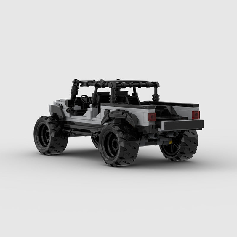 RevvBlox Jeep Gladiator model, detailed miniature toy truck with rugged design and off-road features, on a white background.