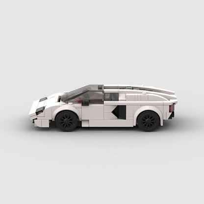 Detailed RevvBlox Lamborghini Countach toy model with orange body and black accents, showcasing sleek sports car design.