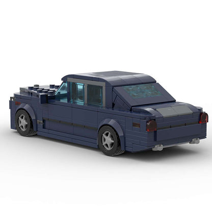 Dark blue LEGO model of a classic four-door sedan with tinted windows and detailed wheels