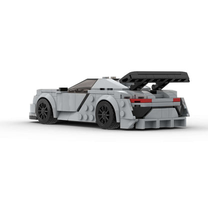 RevVblox Porsche 918 Spyder diecast model car with detailed blue and black exterior, showcasing sleek sports car design.