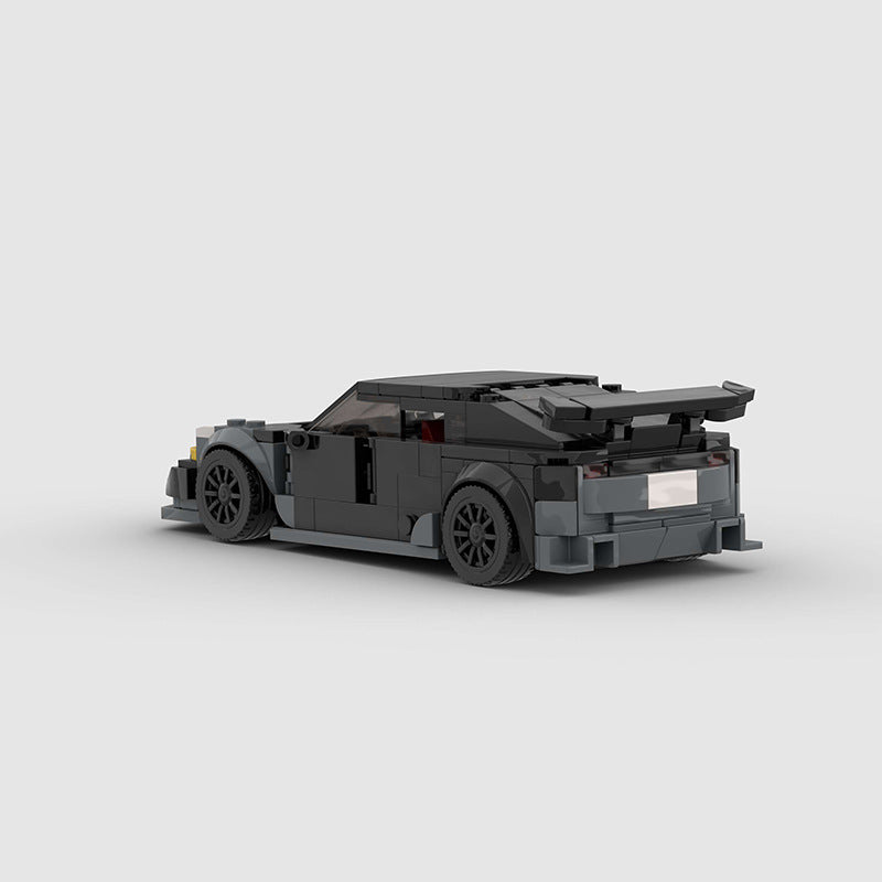 RevvBlox Tesla Model 3 Bionic toy car with detailed blue and black design, showcasing realistic features and sleek shape.