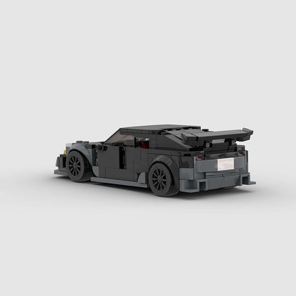 RevvBlox Tesla Model 3 Bionic toy car with detailed blue and black design, showcasing realistic features and sleek shape.