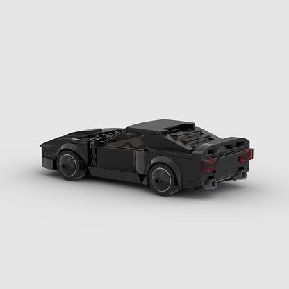 RevvBlox Night Rider toy car with sleek black and red design, detailed wheels, and realistic features for children.