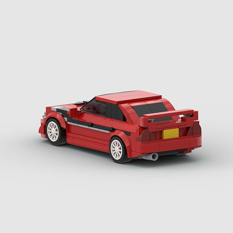 Black Mitsubishi Lancer EVO RevvBlox model car on a white background, showcasing detailed exterior and sporty design.