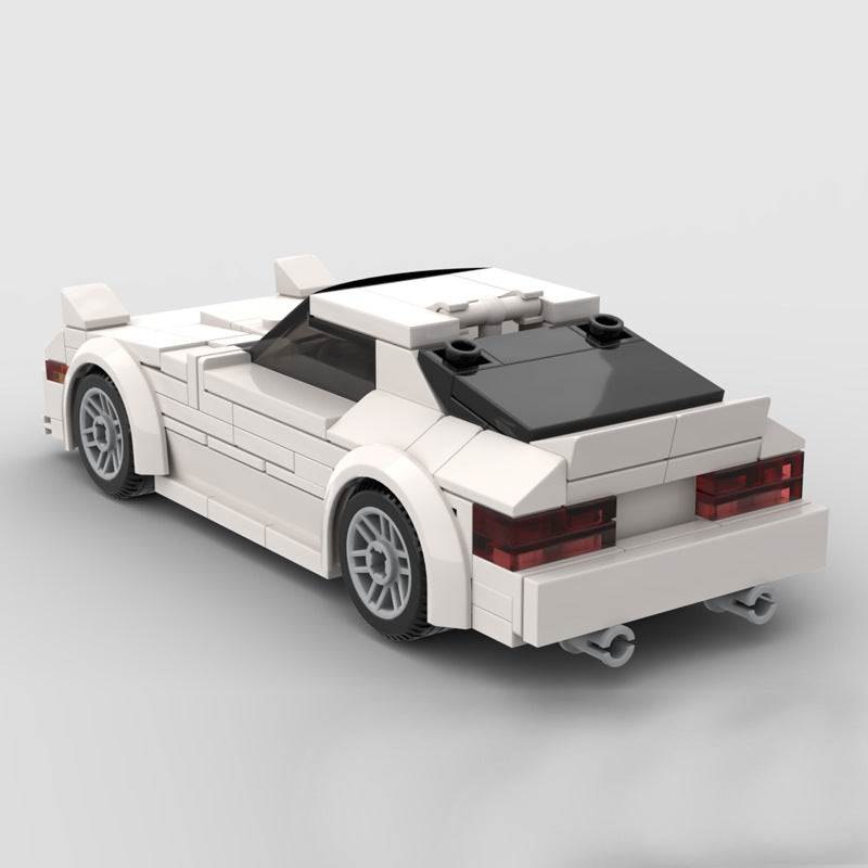 RevvBlox Mazda RX-7 FC model car in white with detailed exterior and sleek design, shown from a side angle.