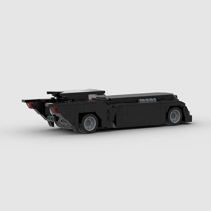 RevvBlox Batmobile toy model with detailed black and gray design, featuring sleek Batmobile features and realistic vehicle details.