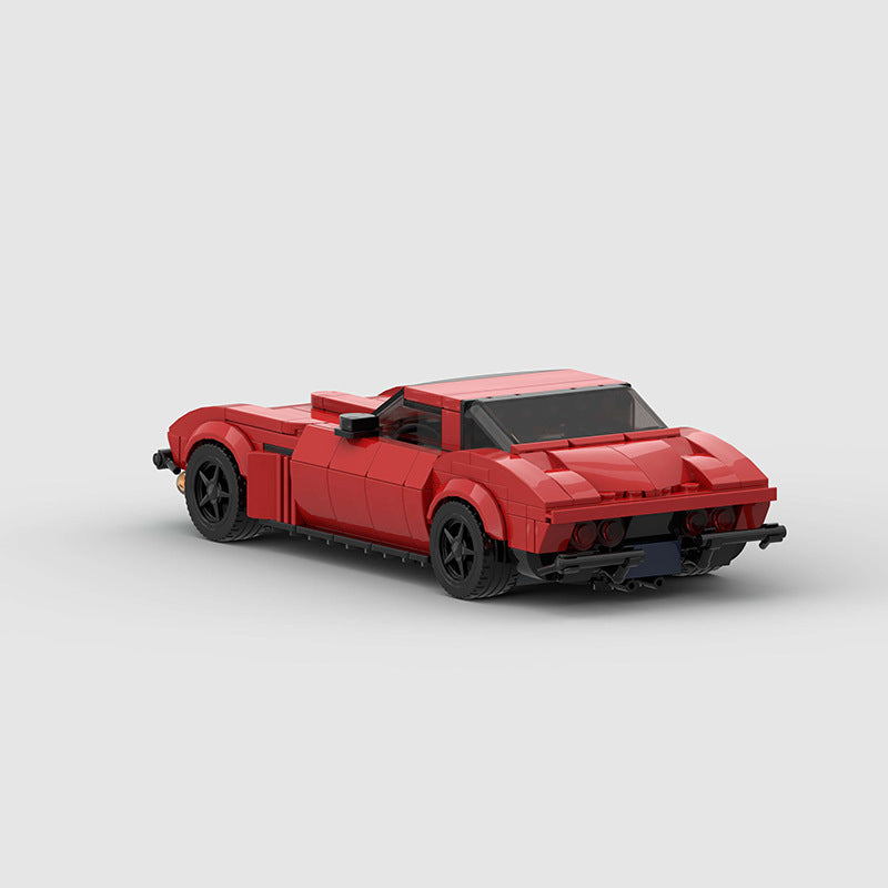 RevVblox Corvette C2 Stingray model car with detailed red and black design, showcasing the classic sports car shape and features.