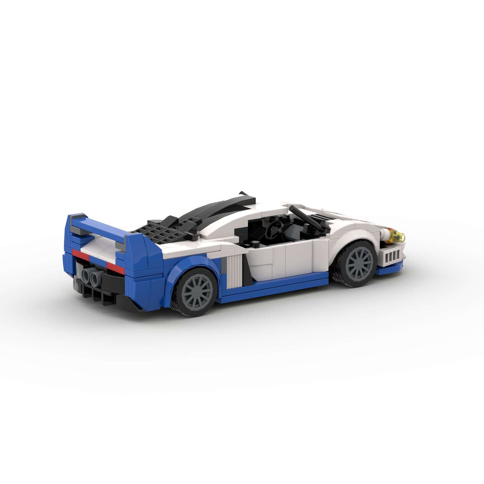 RevvBlox Maserati MC12 model car in blue with detailed design, showcased from a side angle on a white background.