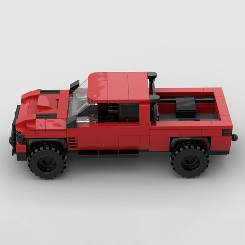 Dodge Ram 1500 TRX toy truck with trailer by RevvBlox, detailed plastic model showcasing truck and trailer in a realistic pose