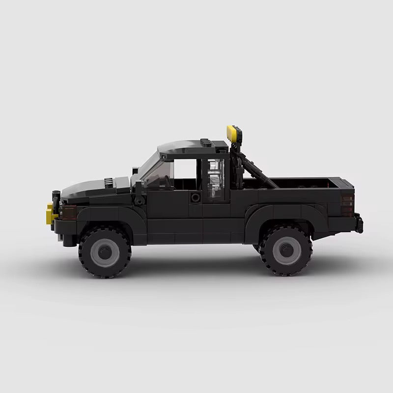 RevvBlox Toyota SR5 truck model with detailed exterior design and realistic features, shown from a side angle.
