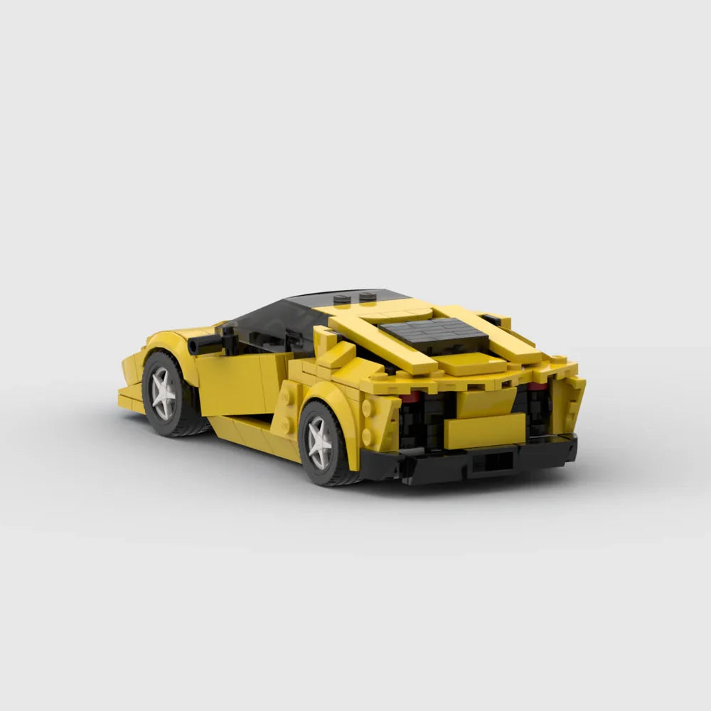 Detailed RevvBlox Lamborghini Aventador toy model with black and yellow exterior, showcasing sleek design and intricate details.