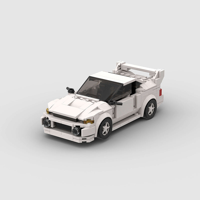 Revvblox Mitsubishi Lancer Evolution Gen V model car with detailed blue and black design, showcasing sporty front and side view.