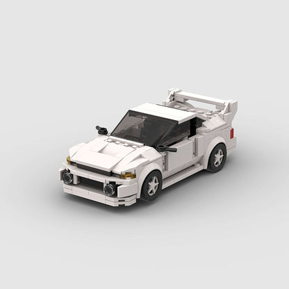 Revvblox Mitsubishi Lancer Evolution Gen V model car with detailed blue and black design, showcasing sporty front and side view.