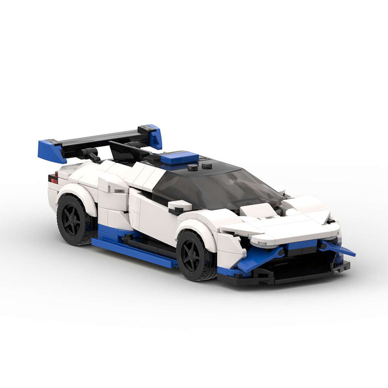 White and blue LEGO sports car model with black wheels and rear spoiler on white background