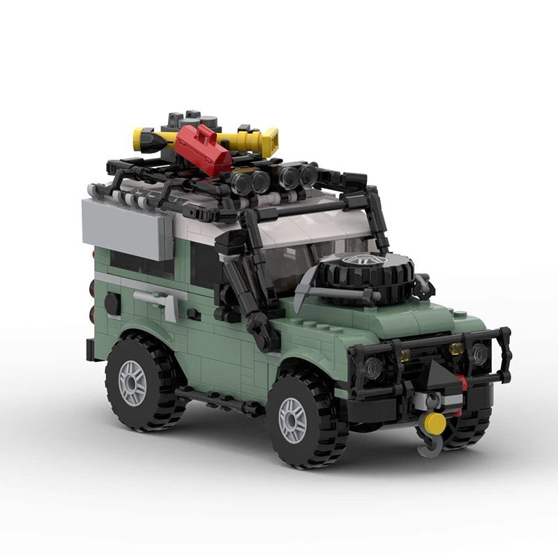 LEGO model of green off-road SUV with roof rack, spare tire, and accessories on white background