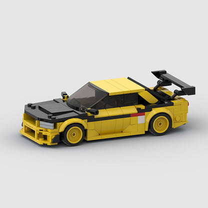 RevvBlox Nissan GT-R R34 model car with detailed blue and silver design, showcasing intricate exterior features and racing decals.