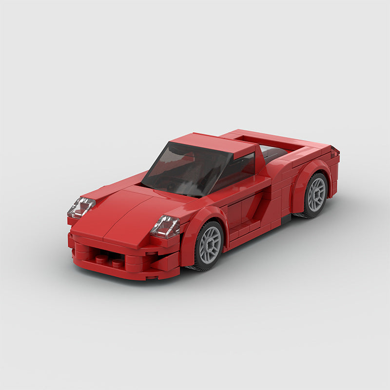 Revvblox Porsche Carrera GT model car with detailed red and silver exterior and realistic design, perfect for collectors.