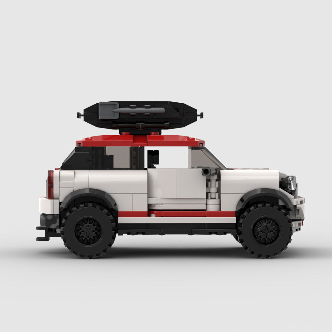 Side view of a Lego white and red SUV with black roof cargo box against white background