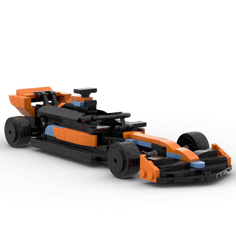 Orange and black LEGO-style race car model with detailed front wing and rear spoiler