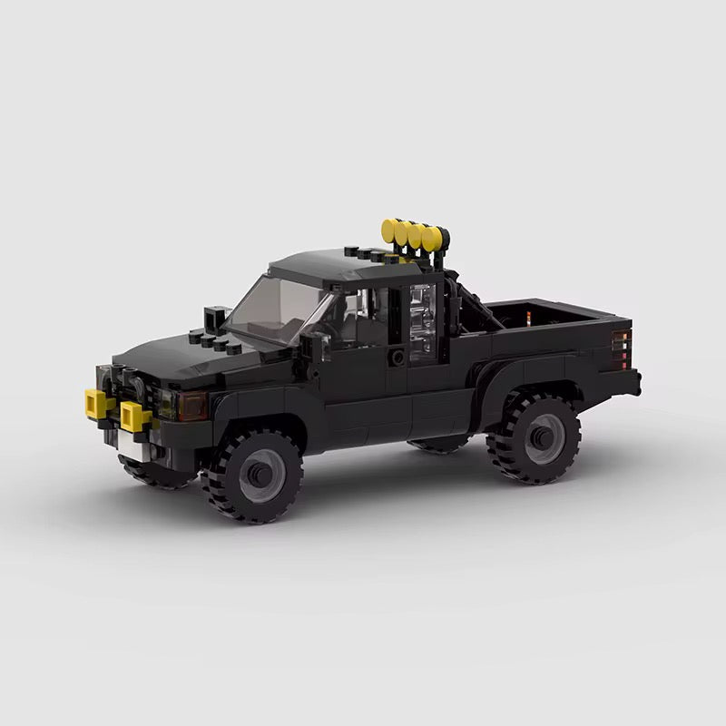 RevVBlox Toyota SR5 truck model featuring detailed exterior with blue and black accents, showcasing realistic design and sturdy construction.