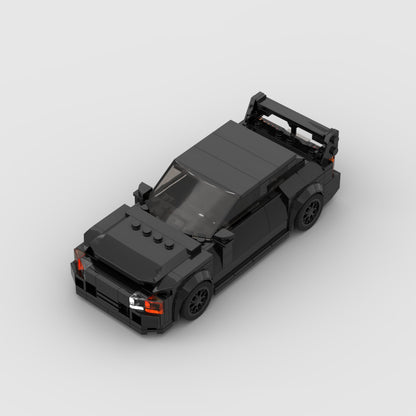 Revvblox Mitsubishi GTO model car in detailed gray and black with realistic features, showcasing a collectible diecast vehicle.