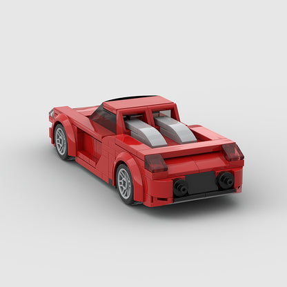 RevVBlox Porsche Carrera GT model car with detailed red and black design, showcasing realistic features and sleek sports car styling.