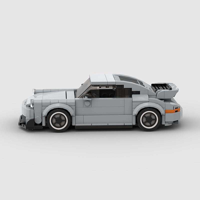 Porsche 911 RWB model by RevvBlox showcasing detailed bodywork and vibrant paint in a realistic display setting.