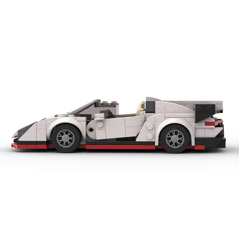 White and black LEGO model of a sports car with red accents and detailed wheels on white background