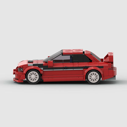 Revvblox Mitsubishi Lancer EVO diecast model car with detailed exterior and vibrant red paint, displayed on a plain background.