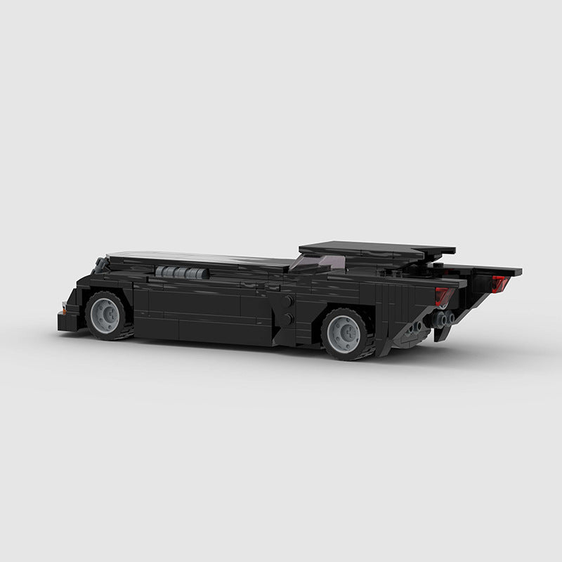RevVBlox Batmobile toy model with detailed black and red design, showcasing a sleek, futuristic vehicle for Batman fans.