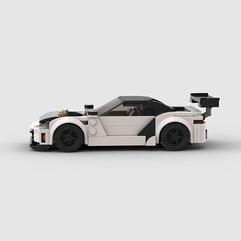RevVBlox Mitsubishi GTO (3000GT) model car in red with detailed exterior and realistic design, showcasing the collectible diecast car.