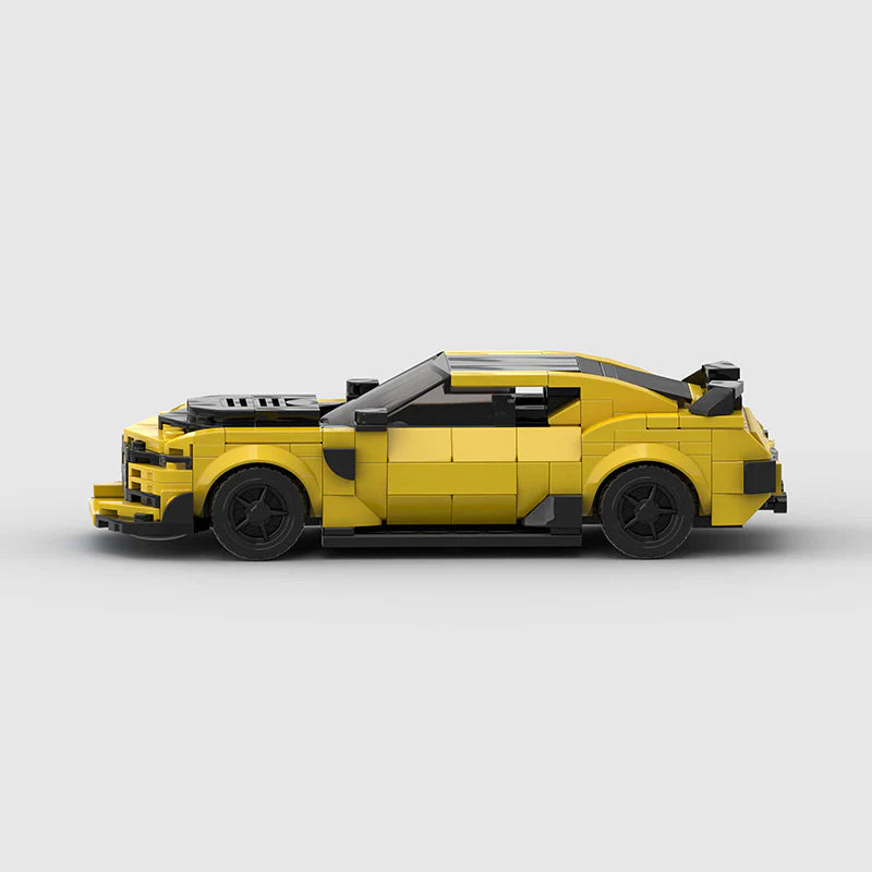 RevvBlox Chevrolet Camaro Bumblebee from Transformers LEGO-style building block toy, detailed yellow and black muscle car model.