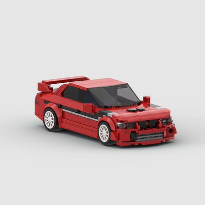 RevVBlox Mitsubishi Lancer EVO model car in red with detailed exterior, showcasing sleek sports car design.