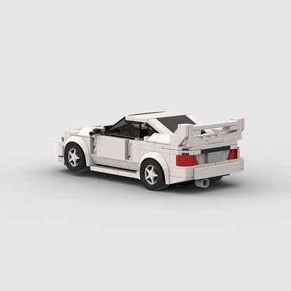 Scale model of a Mitsubishi Lancer Evolution Gen V by RevvBlox, detailed miniature car on a plain background.