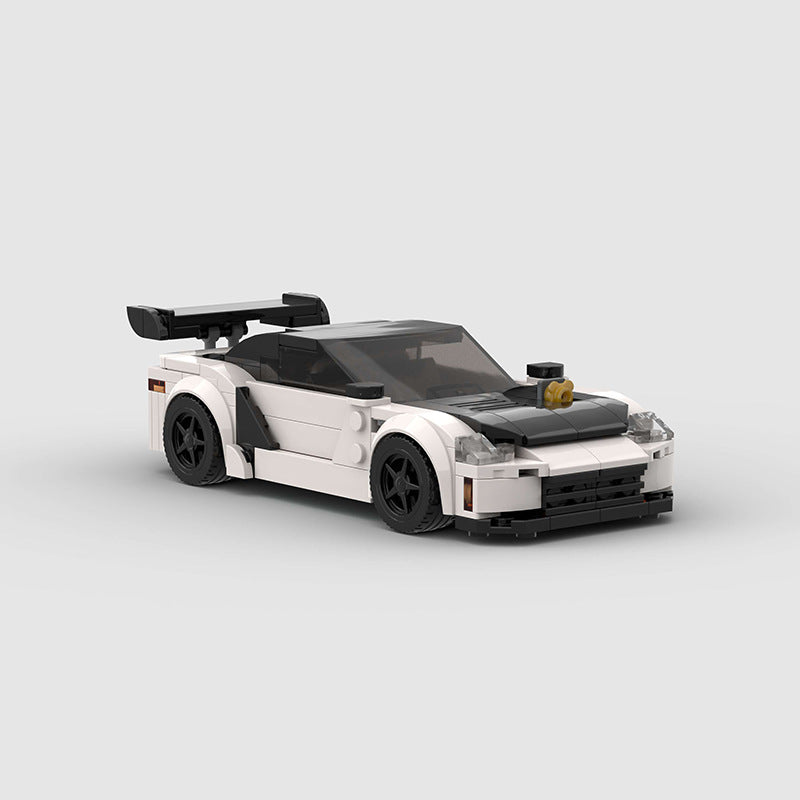 Revvblox Mitsubishi GTO 3000GT diecast model car with detailed exterior in a dynamic pose.